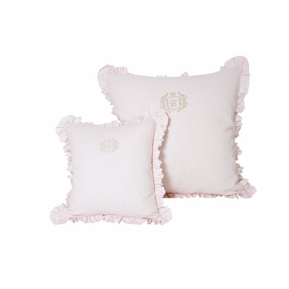 Pink pillows with gold emblem