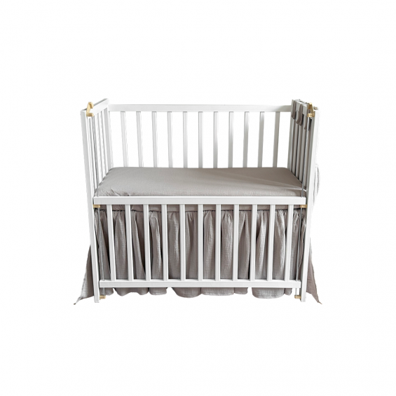 Bedside crib with pocket