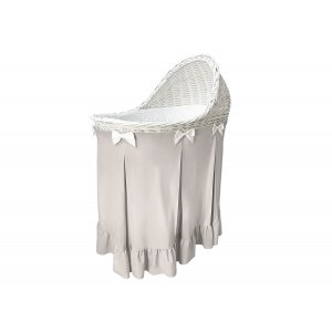 Mobile wicker bassinet with beige skirt with flounce