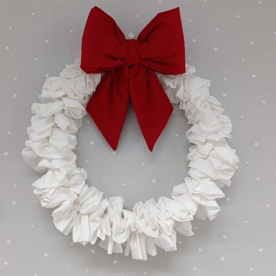 Decorative wreath with a red bow