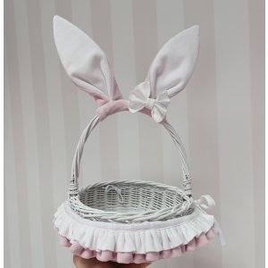 Wicker basket with ears and bow in baby pink