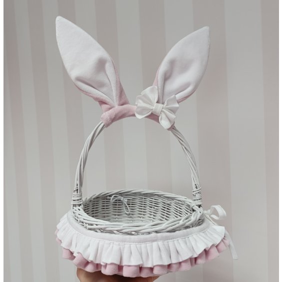 Wicker basket with ears and bow in baby pink